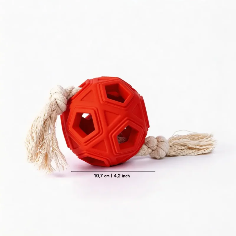 BriteTug Rope Dog Chew Ball size guide showing a red rubber chew ball with geometric openings, cotton rope tug ends, and 10.7 cm / 4.2 inch diameter.