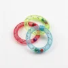 Three Cat Safe Hair Tie Alternative Jingle Mesh Ring Toys in Sky Blue, Raspberry Red, and Lime Green with mesh texture and bells