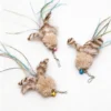 Three DeerFur Jellyfish Cat Wand Replacements with fluffy fur heads, colored bells, feather accents, and dangling tinsel teaser tails.