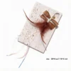 Earthy Brown Raffia Dragonfly Cat Wand Replacement with brown crinkled wings, soft feathers, shiny streamers, bell, and metal clip.