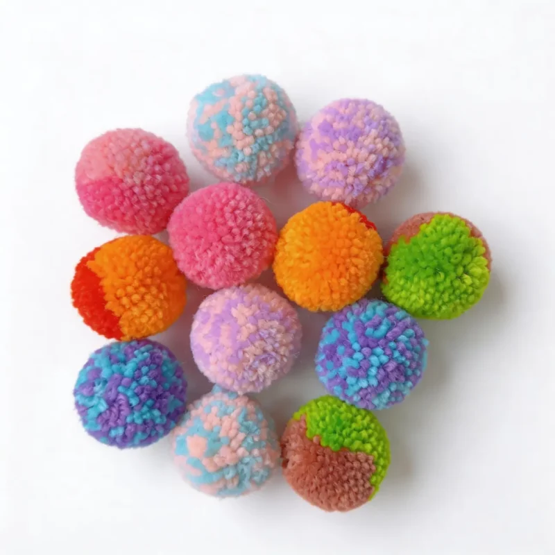 Tuxedo cat playing with Soft Yarn Pom Pom Silent Cat Toy Balls 6 Pack, soft 4 cm quiet balls for indoor cats