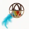 Close-up of Touch Activated Chirping Mouse Cage Ball with rainbow plush mouse and blue feather tail inside cage