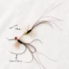 Two black flying insect cat wand attachments showing deer hair, soft ostrich plume, red tinsel, bells, and stainless steel snap clasps.