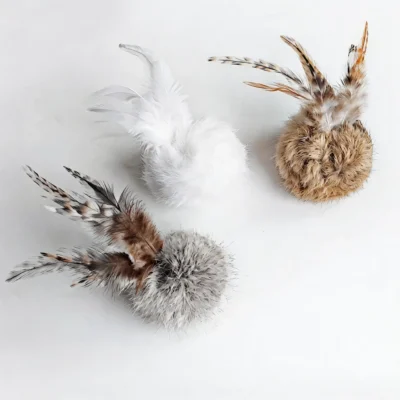 Bunny Fur Scent Enrichment Cat Toy variants in Wild Brown, Smoky Gray, and Cloud White with natural feather tails