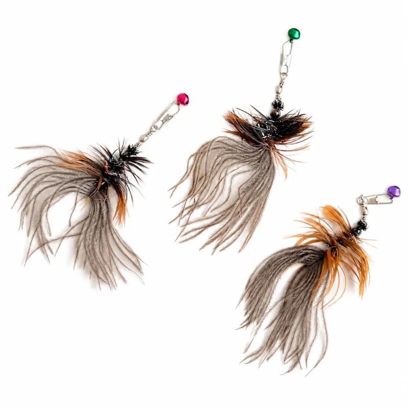 Three handmade cat feather wand replacement attachments with fluffy gray ostrich plumes, brown chicken feathers, metal clips, and colored bells.