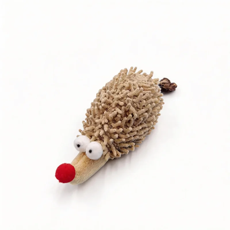 Close-up of the Chenille Hedgehog Cat Kicker Toy showing the dense looped chenille texture, soft plush face, red nose, and attached silvervine fruit tail.