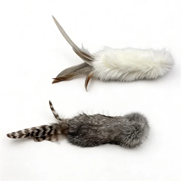 Cream White and Smoky Chirp Bunny Scent Enrichment Cat Kicker Toy options shown side by side, featuring soft rabbit fur bodies and natural feather tails.