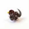Speckled Sparrow Chirpy Bird Tap-Activated Interactive Cat Toy with a yellow beak, fluffy brown wings, spotted feather tail, and built-in hanging loop.