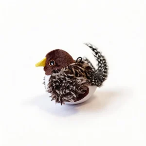Speckled Sparrow Chirpy Bird Tap Activated Interactive Cat Toy Speckled Sparrow Chirpy Bird Tap-Activated Interactive Cat Toy with a yellow beak, fluffy brown wings, spotted feather tail, and built-in hanging loop.