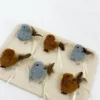 Misty Sparrow and Cinnamon Finch Chirpy Bird Tap-Activated Plush Cat Toy set with fluffy bodies, feather tails, pull tags, and ribbon loops.
