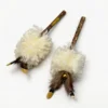 Two Cream Wool Fur Silvervine Kick Sticks with curly wool texture, natural feather accents, small bells, and matatabi wood chew handles for cat enrichment.