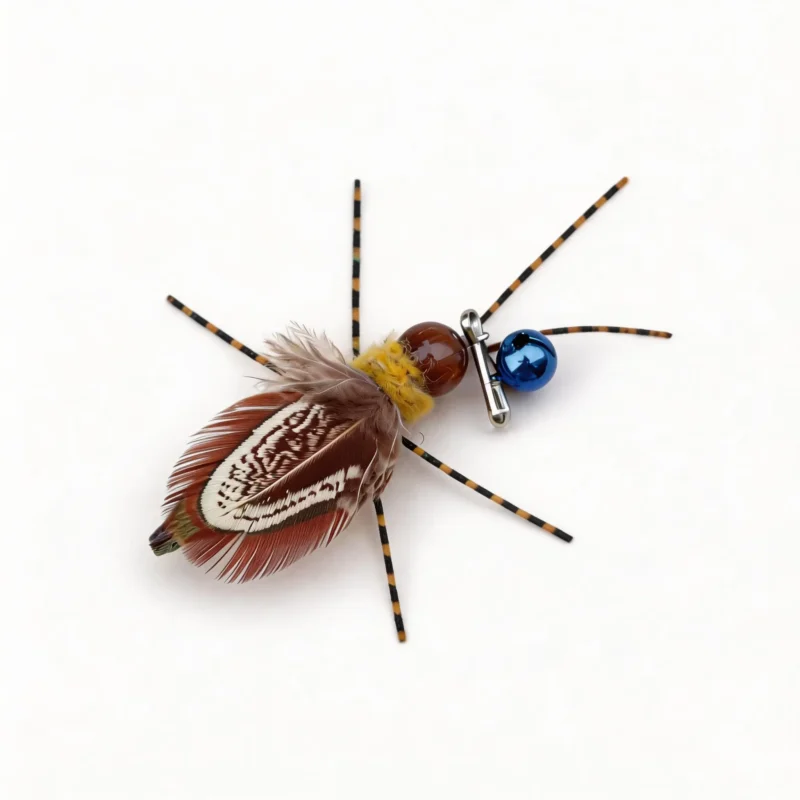 Firefly Flicker Cat Wand Replacement Close Up Firefly Flicker Cat Wand Replacement close-up with natural feathers, striped silicone antennae, wool core, shiny bead body, bell, and metal clip.