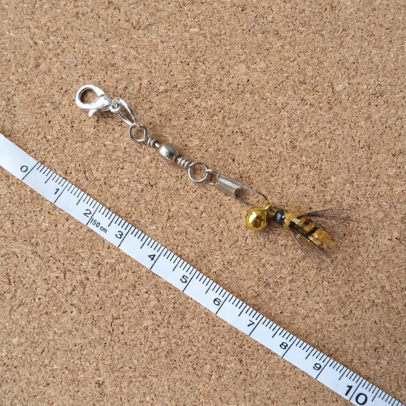 Golden Honey Bee flying insect cat toy with yellow body, translucent wings, and bell attachment, creating an interactive cat teaser for hunting-style play.
