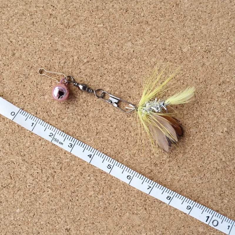 Golden Moth cat teaser wand with fluttering wing details and lightweight fibers, designed as an interactive lure for toys for cats with high prey drive.