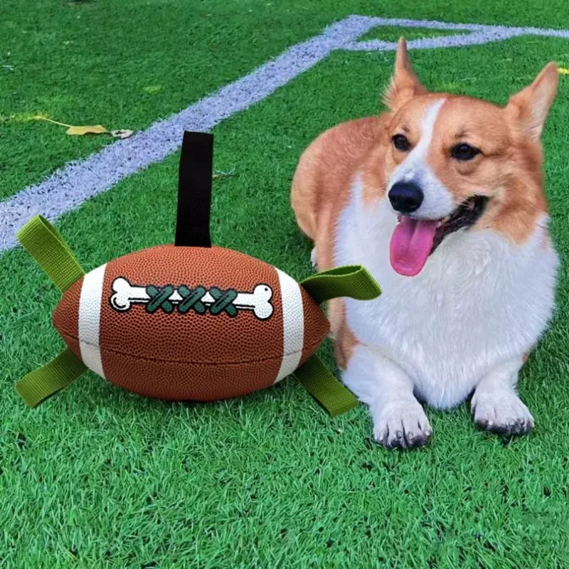 Inflatable Floating Football Tug Dog Toy for Outdoor Lawn Play Corgi resting on grass beside an Inflatable Floating Football Tug Dog Toy for outdoor lawn play