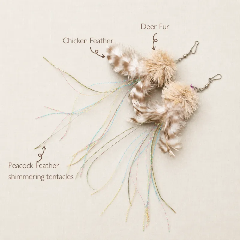 jellyfish-cat-feather-wand-toy-materials Two jellyfish-inspired cat feather wand toy attachments with deer fur bodies, barred chicken feathers, peacock herl and shimmering fiber tentacles.