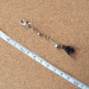Midnight Mosquito cat teaser wand replacement featuring a tiny black flying insect design, feather-like wings, and bell detail for interactive cat teaser play.