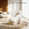 Small white dog chewing the Milky Starfruit Natural Rubber Dog Chew Toy, shown as tailor-made for small and medium breed pups.