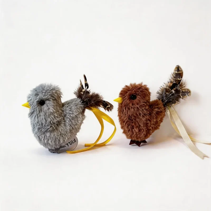 Misty Sparrow and Cinnamon Finch Chirpy Bird Tap-Activated Plush Cat Toys shown together with fluffy plush bodies, yellow beaks, feather tails, and ribbon loops.