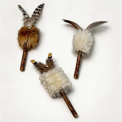 Natural Rabbit Fur & Wool Silvervine Cat Toy Set Three Natural Rabbit Fur & Wool Silvervine Cat Toys in golden, cream wool, and white fur styles with feathers, bells, and silvervine chew sticks on a white background.