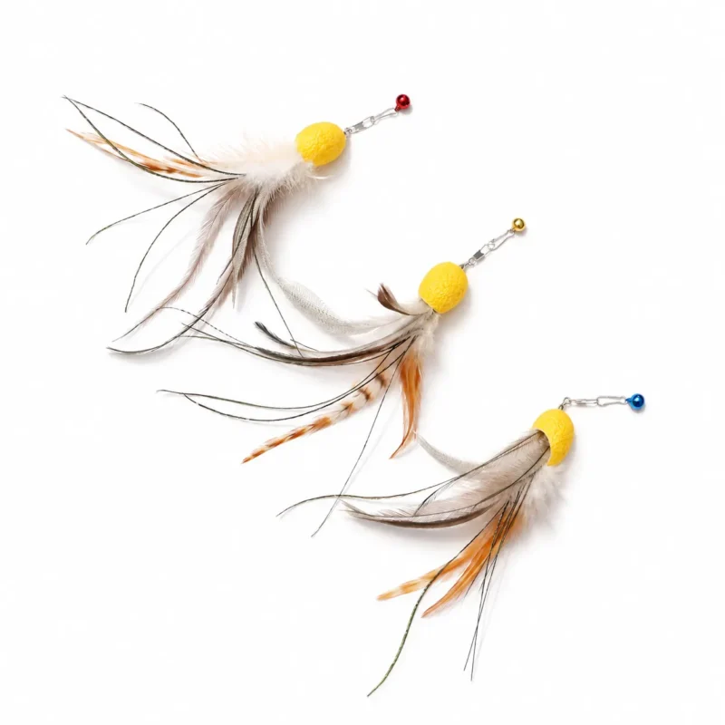 Three octopus cat toy lures arranged on white, showing varied natural feather patterns, long peacock herl strands, yellow bodies, and colored bells.