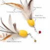 Material details of the Octopus Cat Toy Teaser Replacement Lure showing peacock herl, duck feathers, barred chicken feathers, and bright yellow cocoon-shaped bodies.