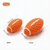 Orange Honeycomb Squeaky Football Dog Toy size chart showing Small and Large options, with 10.3 x 5.8 cm and 14.2 x 8.2 cm measurements.