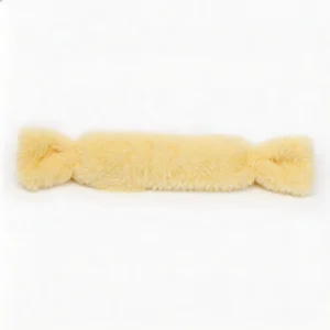 Buttercream Bunny Candy Rabbit Fur Candy Cat Kicker Pillow Buttercream Bunny Candy Rabbit Fur Candy Cat Kicker Pillow on a white background, featuring a long soft yellow plush candy shape for cats to bite, hug, wrestle, and kick.