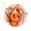 Close-up view of shrimp cat teasers wand refills with mesh shells, feather tails, and shimmering whiskers designed for interactive hunting toys for cats.