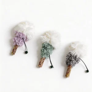 Lavender, Mint, and Ash Silvervine Fluffy Lollipop Cat Chew Toy variants with fluffy white tops, curled plush texture, silvervine sticks, black loops, and green bells.