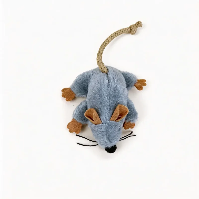 Tiny Mouse Hunt Plush Cat Toy With Rope Tail Tiny Mouse Hunt Plush Cat Toy in soft gray plush with tan ears, orange paws, black whiskers, and a knotted rope tail on a white background.