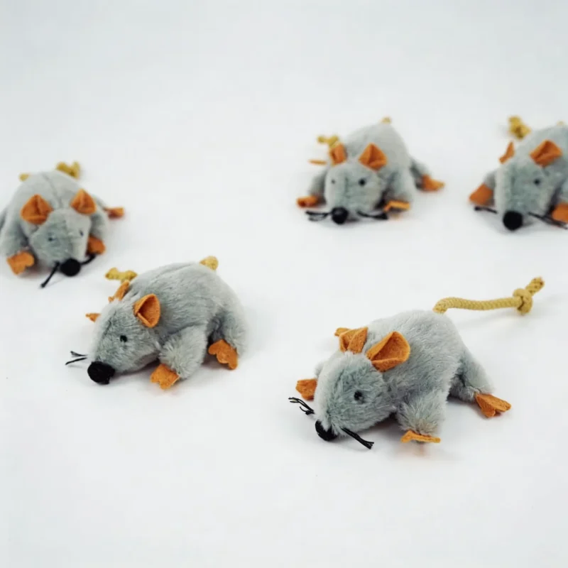 Tiny Mouse Hunt Plush Cat Toy Multipack Display Set of gray Tiny Mouse Hunt Plush Cat Toys arranged on a white background, each with a soft plush body, rope tail, tan ears, orange paws, and black whiskers.