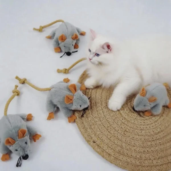 White cat resting beside Tiny Mouse Hunt Plush Cat Toy, a soft mouse-shaped toy for indoor cats to chase, bite, and carry