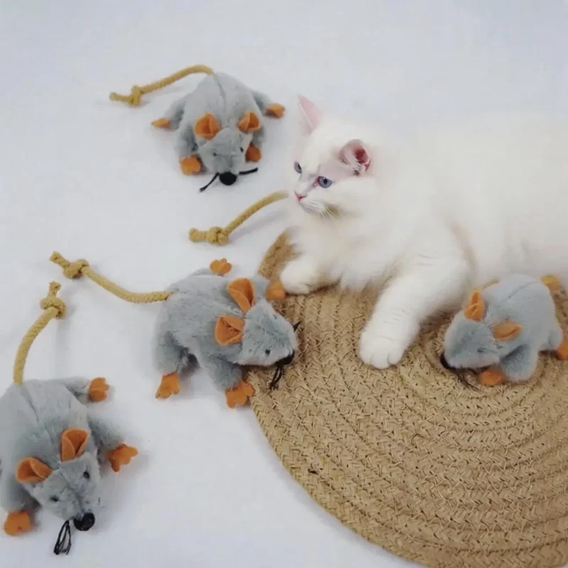 Tiny Mouse Hunt Plush Cat Toy for Cat Play White cat resting beside Tiny Mouse Hunt Plush Cat Toy, a soft mouse-shaped toy for indoor cats to chase, bite, and carry