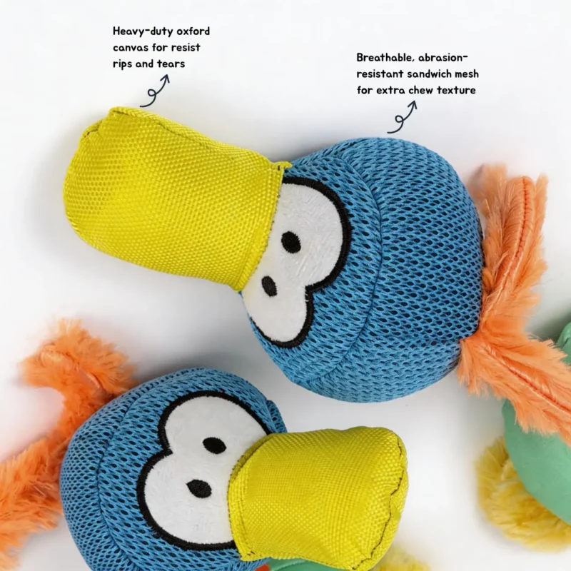Toucantuff Tug Chew Dog Toy Oxford Ccanvas Mesh Detail Close-up of the ToucanTuff Tug & Chew Plush Rope Dog Toy showing heavy-duty oxford canvas beak and breathable abrasion-resistant mesh head.