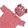 Close-up of Piggy Puff soft corduroy plush pig dog toy with textured fabric and cute snout