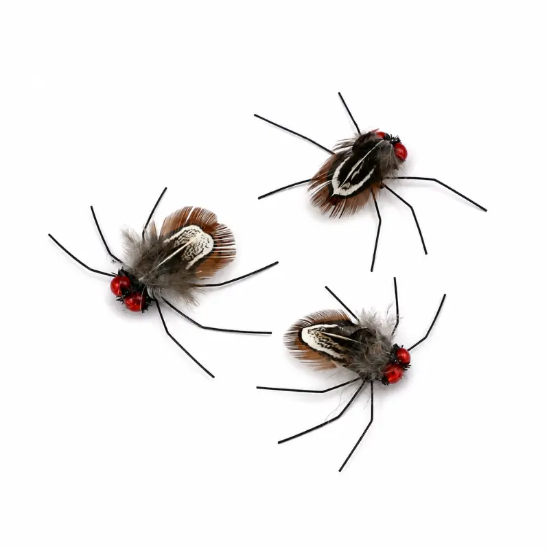 beetle-cat-wand-with-feathers-prey-design Beetle cat wand with feathers featuring red eyes, thin legs, and feather wings that mimic the movement of small flying prey