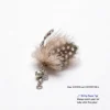 BioBug Pearl Moth feather cat wand replacement with spotted wing feathers, natural deer hair texture, bell, and metal clip for indoor cat enrichment.