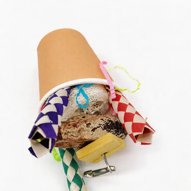 Kraft Snack Cup Shredding Bird Toy Top View Top view of Kraft Snack Cup Shredding Bird Toy with cork bark, loofah, woven paper tubes, and chewable textures