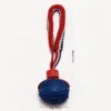 Navy Football Spiky SportLoop Textured Tug Ball Dog Toy with textured rubber football ball and woven tug loop, 7 cm by 28 cm