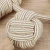 Close-up of handwoven rope knot texture on a dog rope chew toy, showing braided fibers and detailed knot for dog rope design.