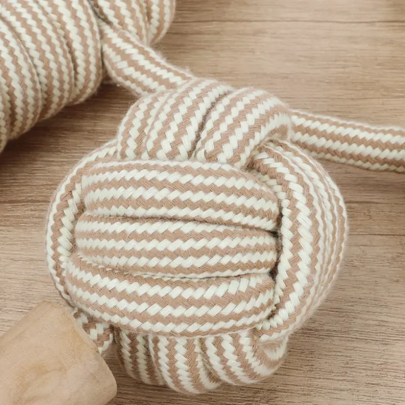 Close-up of handwoven rope knot texture on a dog rope chew toy, showing braided fibers and detailed knot for dog rope design.