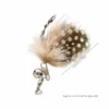 little-moth-guinea-fowl-feather-cat-wand-replacement-5-5cm Little Moth cat wand replacement with white-spotted guinea fowl feather wings, soft deer hair body, silver bell and 5.5 cm length.