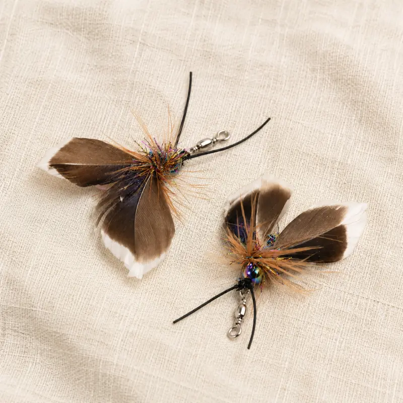 Midnight Forest Moth flying bug cat toy with feather wings, colorful fibers, and detailed antenna design inspired by a nighttime insect.