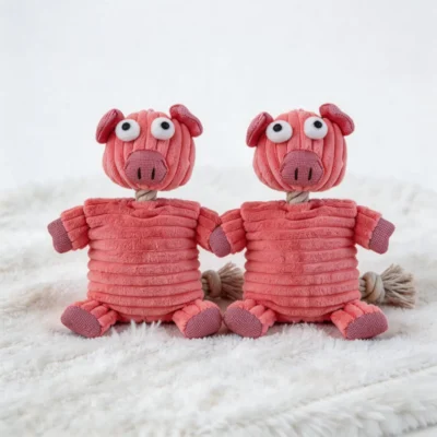 Piggy Puff No-stuffing Squeaky Dog Toy Main Piggy Puff No-Stuffing Squeaky Dog Toy in pink plush pig design for indoor dog play