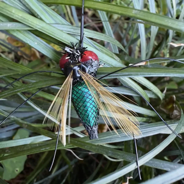 Realistic Fly Teaser Refill for Indoor Cat Enrichment with feather wings, green body and wand clip on white background