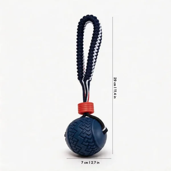 Navy Tire Tread SportLoop Textured Tug Ball Dog Toy with grippy rubber ball and navy woven tug loop, 7 cm by 29 cm
