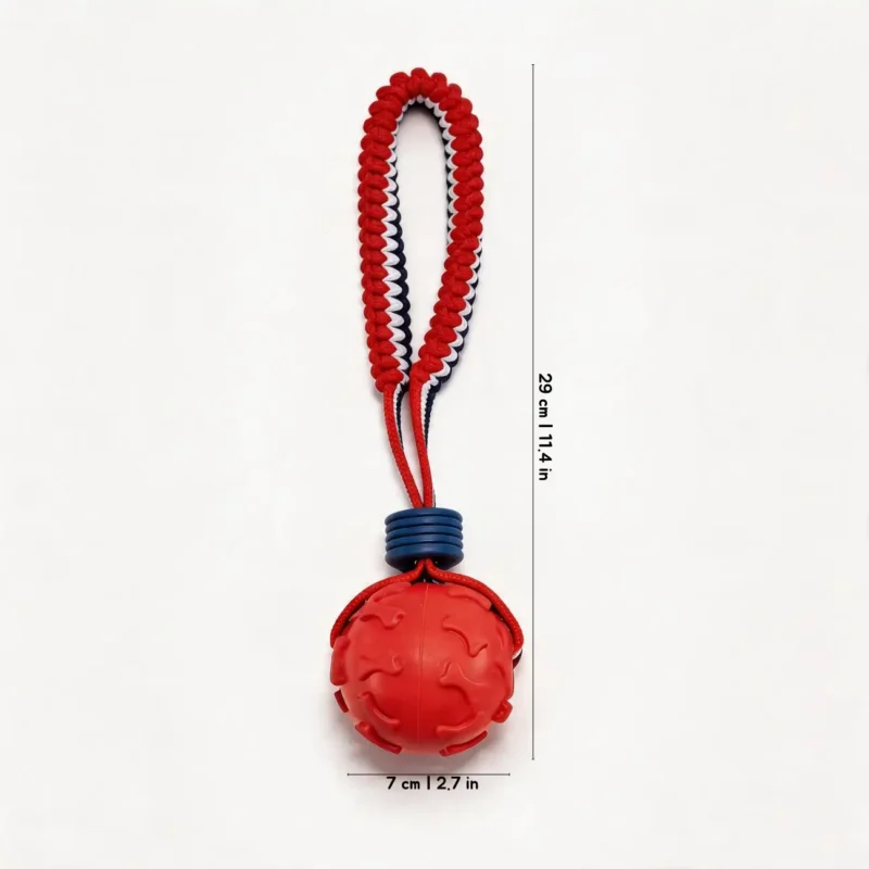 Sportloop Textured Tug Ball Dog Toy Red Bone Embossed Red Bone Embossed SportLoop Textured Tug Ball Dog Toy with raised bone pattern rubber ball and bungee rope handle, 7 cm by 29 cm