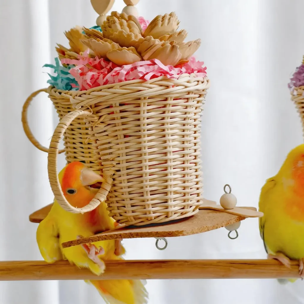 Lovebird playing with Afternoon Tea Foraging Bird Toy made with rattan cup, soft cork, wood pieces and crinkle paper