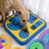 Dog using a 4-in-1 Dog Enrichment Puzzle & Slow Feeder to sniff, slide, and find hidden kibble